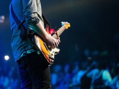 How to become a musician - a guitarist on the stage in front of a crowd